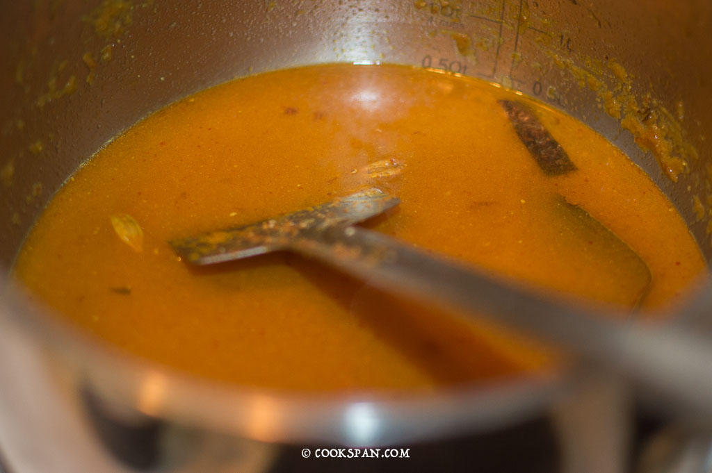 Adding the water to the Masala