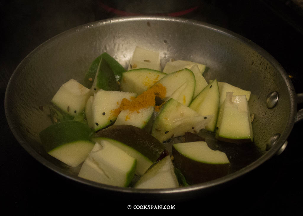 Adding the turmeric and salt