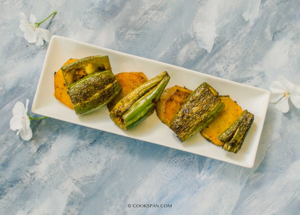 Pura Dia Chachindra Bhaja or Stuffed Snake Gourd Fry