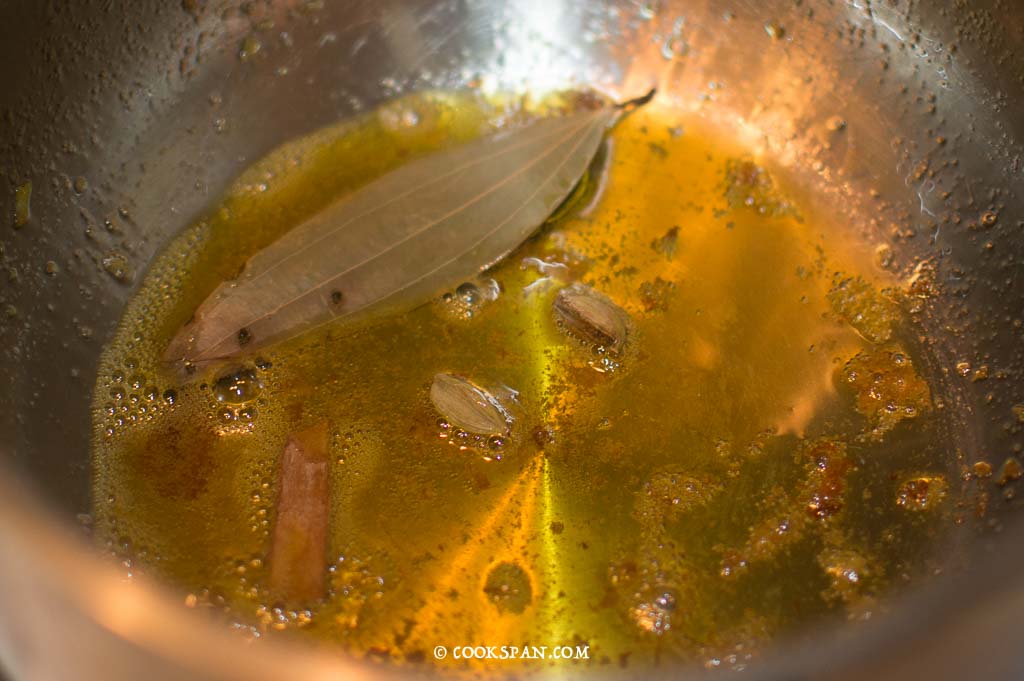 Adding the whole spices Bay Leaves, Cardamom and cinnamon
